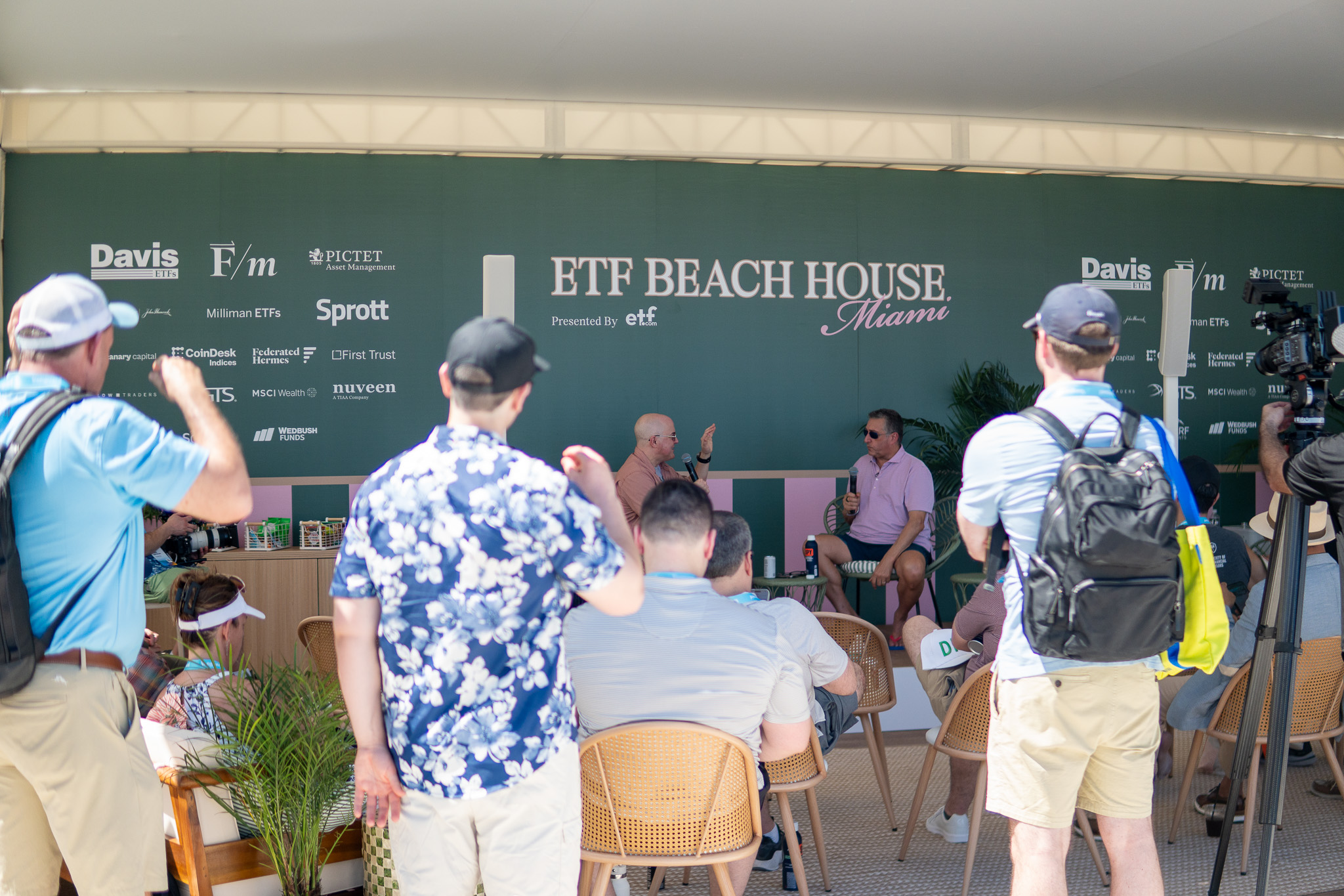 Dave Nadig and Barry Ritholtz talk in front of a crowd at Beach House.