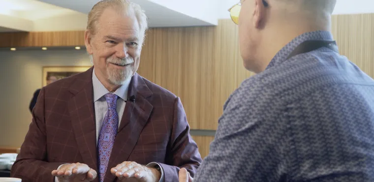 Rob Arnott smiles while being interviewed at Basis NW