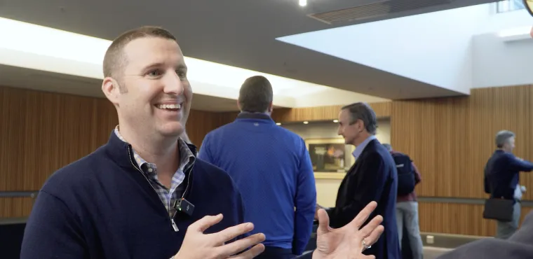 Phil Huber smiles while talking with Dave Nadig at Basis Northwest
