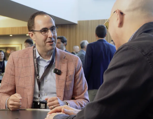 Alex Morris smiles while talking with Dave Nadig at Basis Northwest