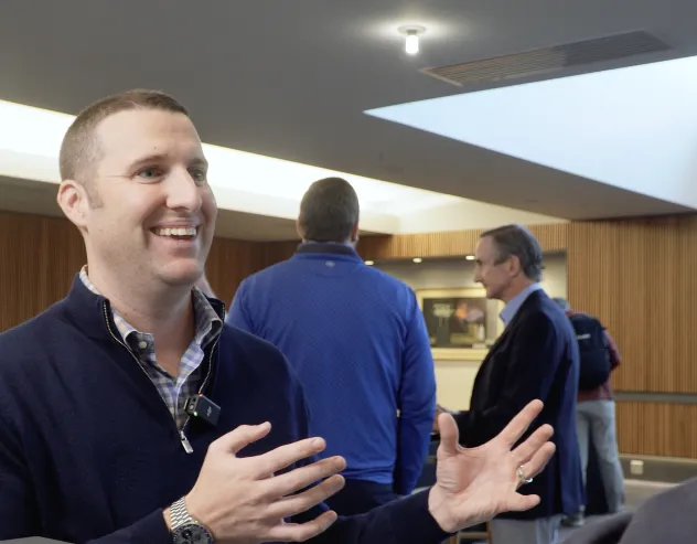 Phil Huber smiles while talking with Dave Nadig at Basis Northwest