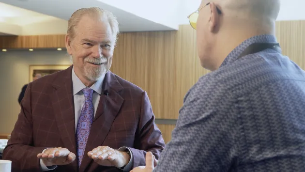 Rob Arnott smiles while being interviewed at Basis NW