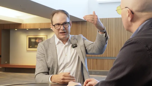 John West gestures while talking with Dave Nadig at Basis Northwest