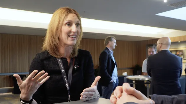 “Diversification Means Always Having to Say You’re Sorry" Caroline Barnett smiles while talking with Dave Nadig at Basis Northwest