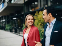 Learn How to Navigate ETF Premiums and Discounts People walking and smiling