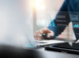 Businessman using tablet analyzing business growth graph data