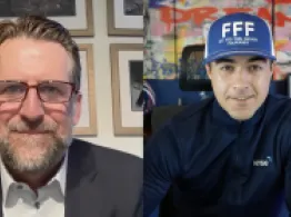 Brad Roth in an FFF hat talks with Michal Monaghan