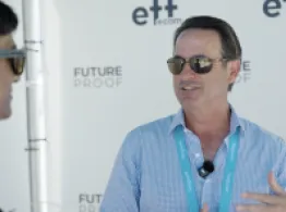 Ed Coyne of Sprott smiles while talking with Sumit Roy