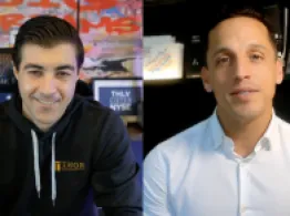 Brad Roth and Sean Emory smile while talking