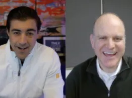 Brad Roth and Chris Tessin both smile while talking