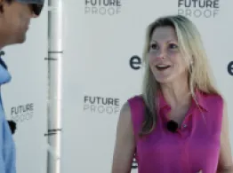 Kristie Feinberg of John Hancock smiles while talking to Sumit Roy