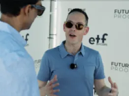 Pictet’s David Wright smiles while talking to Sumit Roy