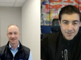 Mo Sparks and Brad Roth smile while talking