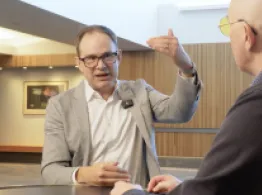 John West gestures while talking with Dave Nadig at Basis Northwest