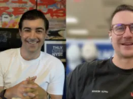 Behind the Ticker: WARPing Into Space with VanEck Nicke Frasse and Brad Roth smile while talking