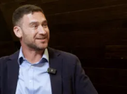 ICI’s Weinberg: An Insider's View of ETF Industry Priorities Josh Weinberg smiles while talking at the 2026 ICI ETF Conference