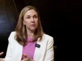 Julie Gunts gestures while talking at the 2026 ICI ETF Conference